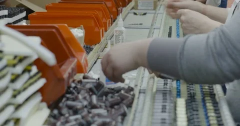 Workers hands manually assemble Electronic parts Видео 73502834