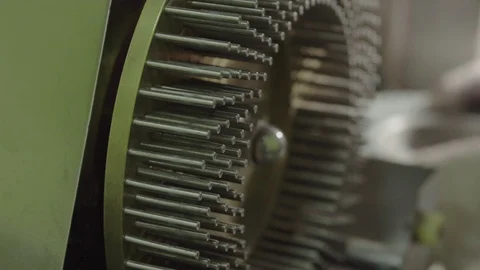 Workers hands removing equipment with blue-green hard shelled capsules Stock Footage 102457476