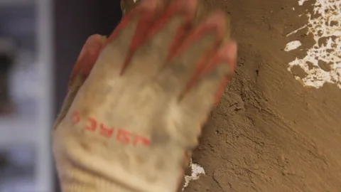 Worker's hands repair the corner of the wall Stock Footage 122702629