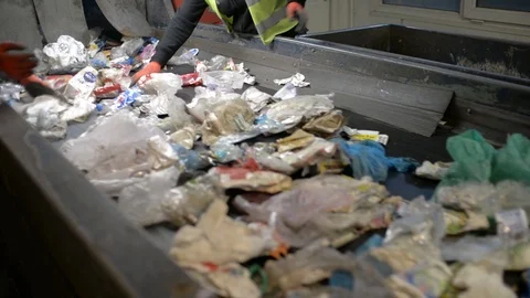 Workers Hands sorting Plastic waste moving on Conveyor, Garbage sorting Station Stock Footage 88734466
