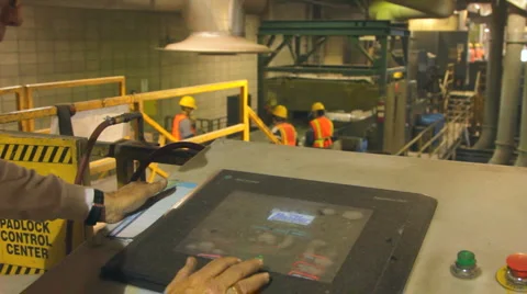 WORKERS HANDS ON TOUCHSCREEN AT RECYCLING PLANT Stock-Footage 6525891