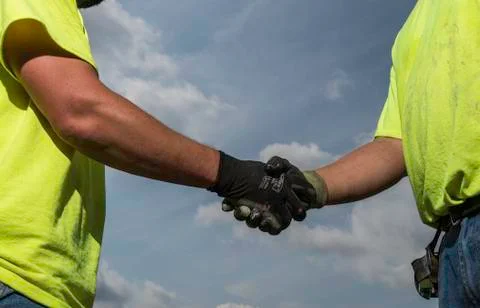 Workers handshake Stock Photos
