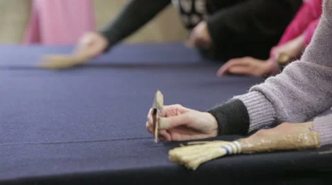 Workers in a Harris Tweed mill checking the quality of the fabric Stock Footage 58495251