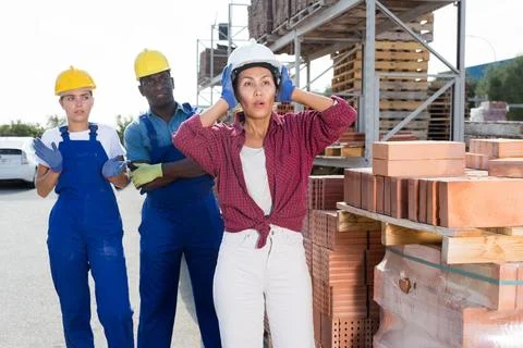 Workers have problems at work at a hardware store Foto stock