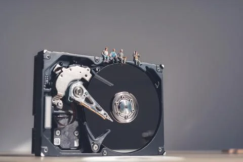 Workers having a break on top of giant HDD Stock Photos