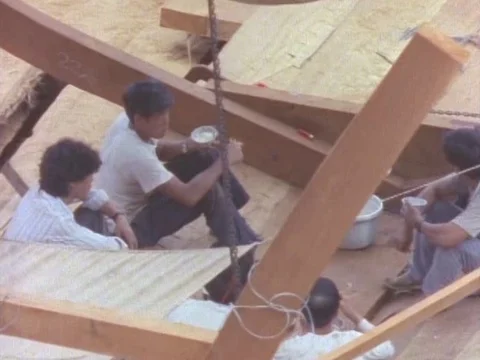 Workers having their lunch break as they sit together and share food Stock Footage 79878909
