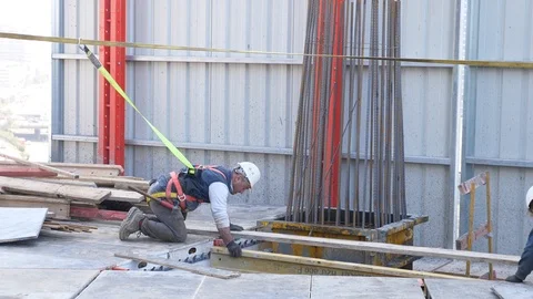 Workers at the height are tied in harnesses Stock Footage 104746527