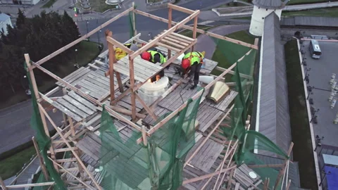 Workers at height work on location for star installation Stock Footage 253820162