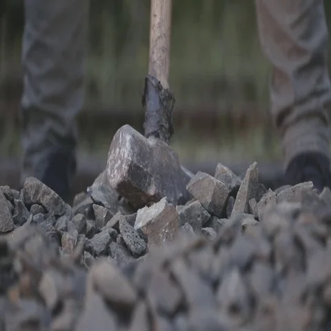 Workers hitting rocks Stock Footage 69721990