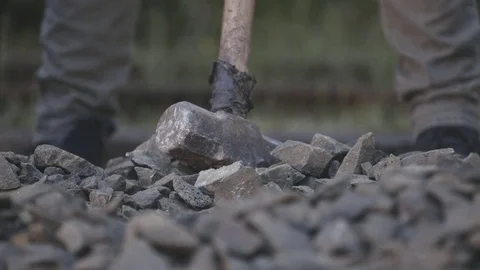Workers hitting rocks Stock Footage 69722480
