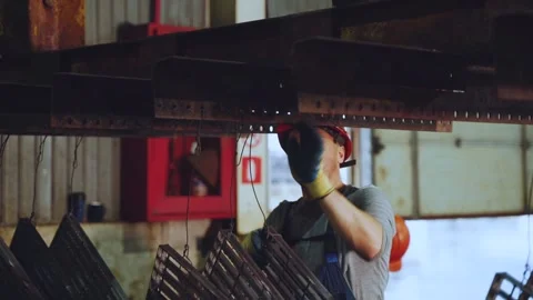 Workers at the hot-dip galvanizing plant Stock Footage 241606320