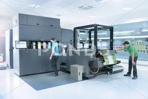 Workers With Ink Jet Printer In Food Packaging Printing Factory