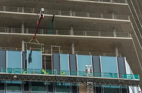 Workers inserting windows on a high-rise building, Frankfurt am Main, Germany Stock Photos