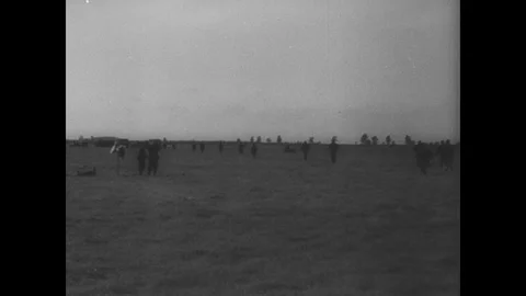 Workers inspect damanged plane and plan next attack Stock Footage 103388408