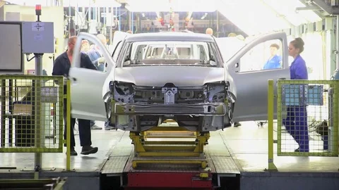 Workers inspect the geometry of the car body at AVTOVAZ plant Stock-Footage 73480304