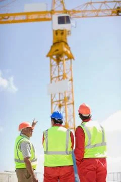 Workers inspecting a building plot Fotos de archivo