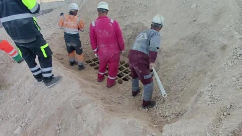 Workers Inspecting Industrial Ground Grating at Cement Plant 4K Vídeos de archivo 334136090