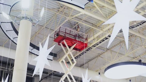 Workers install elements on shopping mall ceiling time lapse Stock Footage 111574086