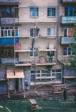 Workers install frame structure for house renovation Stock Photos