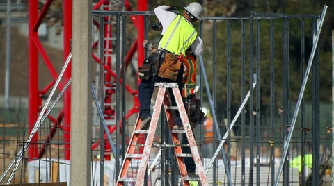 Workers install a metal pile frame at construction site Stock Footage 34521906
