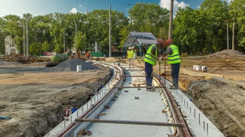 Workers install new tram rails during a ... | Stock Video | Pond5