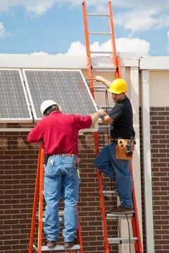 Workers Install Solar Panels Stock Photos