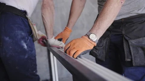 Workers install a window in a new home Stock Footage 219424067