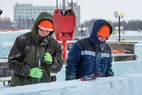 Workers on the installation of the ice town 스톡 사진