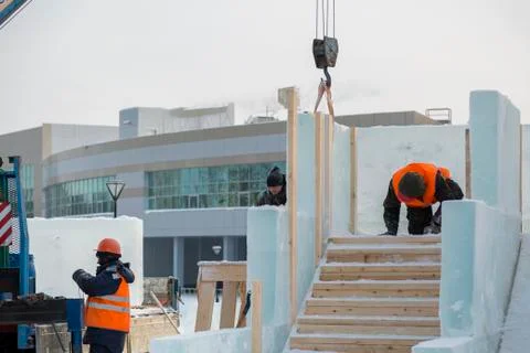 Workers on the installation of the ice town 스톡 사진