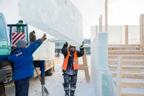Workers on the installation of the ice town Stock-Fotos