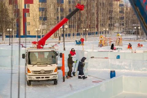 Workers on the installation of the ice town 스톡 사진