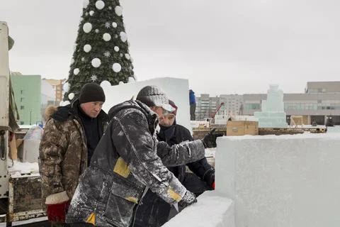 Workers on the installation of the ice town 스톡 사진