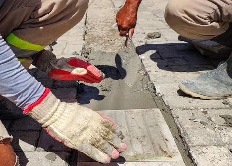 Workers installing concrete flooring Stock Photos