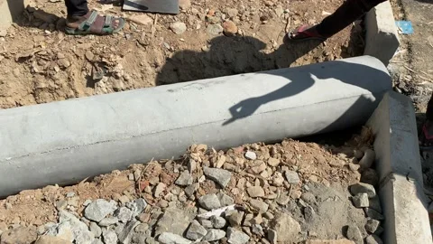 Workers installing industrial construction oil and gas or water pipeline Stock Footage 167516318
