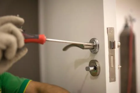 Workers installing locks Stock Photos