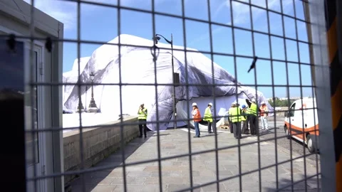 Workers Installing Monumental JR Art Piece Over Pont Neuf Bridge in Paris Stock Footage 336460617