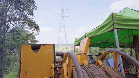 Workers installing optic fiber cable with machinery in a rural area Stock Footage 341996805