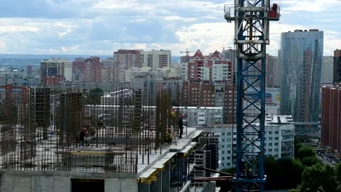 Workers installing reinforcement and formwork. Crane work at construction site Stock Footage 150074229