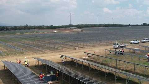 Workers installing solar panels at a construction site, Dominican Republic Stockbeeldmateriaal 344821041