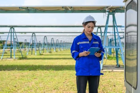 Workers installing solar panels, Engineer team at solar panel farm Stock Photos