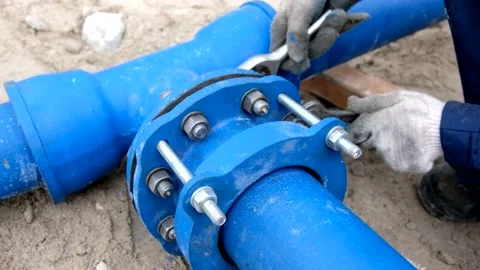 Workers installing water supply pipeline system, close up Stock Footage 231984636