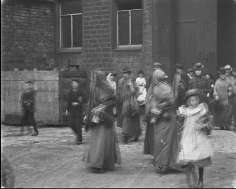 Workers leaving mill, Workers of Cheetham's Bankwood Mills, Stalybridge 1900 Stock Footage 133373380