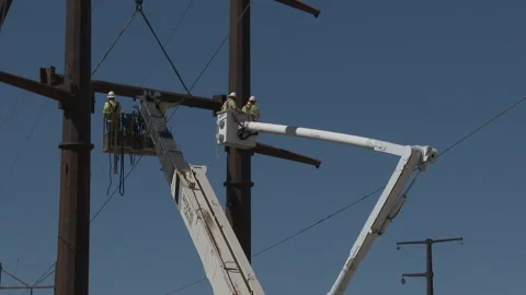 Workers lifted in construction of Electric Grid b, 4K. Stock Footage 246976281