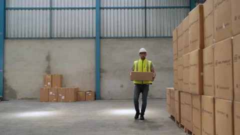 Workers lifting boxes in the warehouse, concept of distribution Stock-Footage 154876236