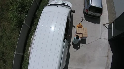 Workers load cargo in car Stock Footage 41339867