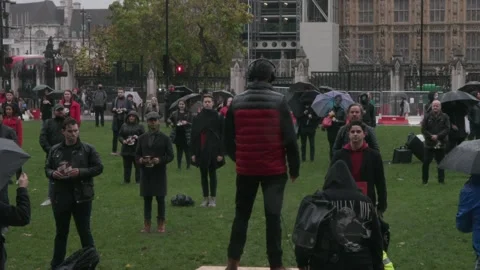 Workers from London’s West End theatres hold a falshmob in Parliament Square Stock Footage 148551093