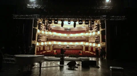 Workers lower metal frame for light equipment on stage Video stock 28505309