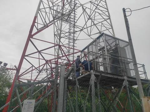 Workers Maintaining Cell Tower Platform Stock Photos