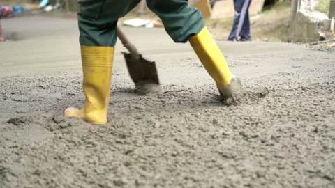 Workers make a concrete path Stock Footage 143899081