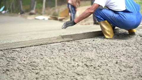 Workers make a concrete path Stock Footage 143899136